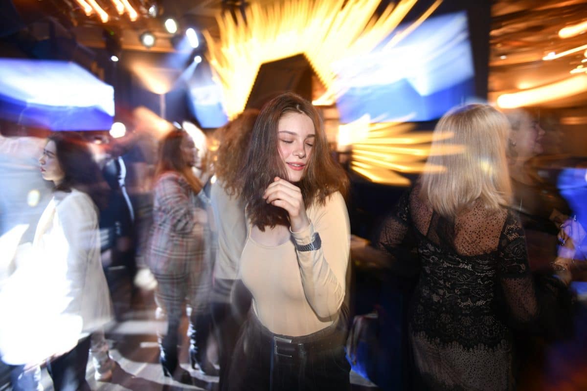 Woman in Long Sleeves Partying at Club